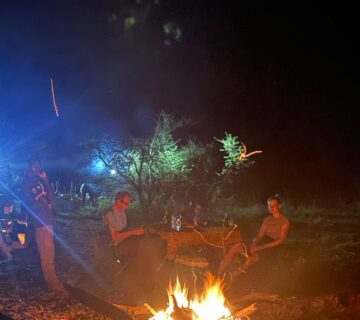 bush camp fire in protected areas of uganda, after bush dinner