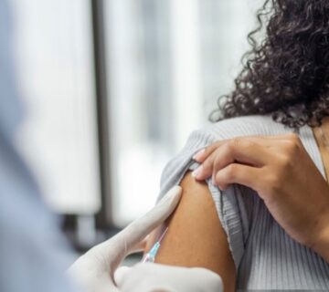 Traveler receiving Uganda vaccinations before safari to ensure health and safety during wildlife adventure