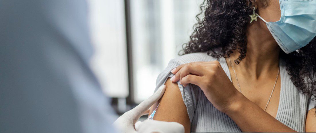 Traveler receiving Uganda vaccinations before safari to ensure health and safety during wildlife adventure