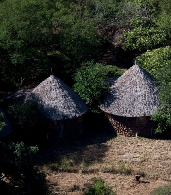 Mountain huts on Mount Kenya providing shelter for hikers amid scenic alpine landscapes and rugged terrain.