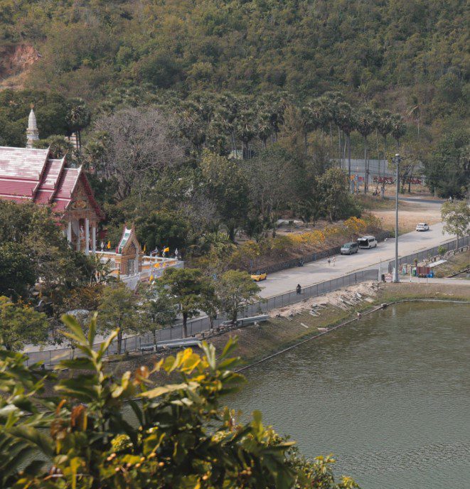 Serengeti riverbank surrounded by natural wilderness and calm water, showcasing serene outdoor adventure.