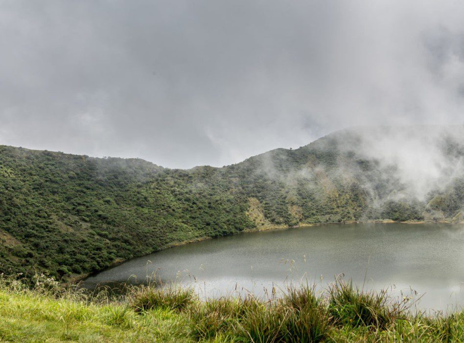 Scenic view of Mount Bisoke in Rwanda’s Volcanoes National Park with lush greenery and volcanic landscapes