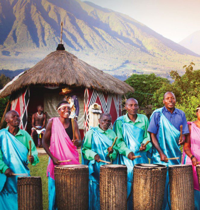 Local Villagers Perfoming Rwandan locals engaging in traditional dance, demonstrating respect for elders, and wearing modest clothing in a vibrant cultural setting."