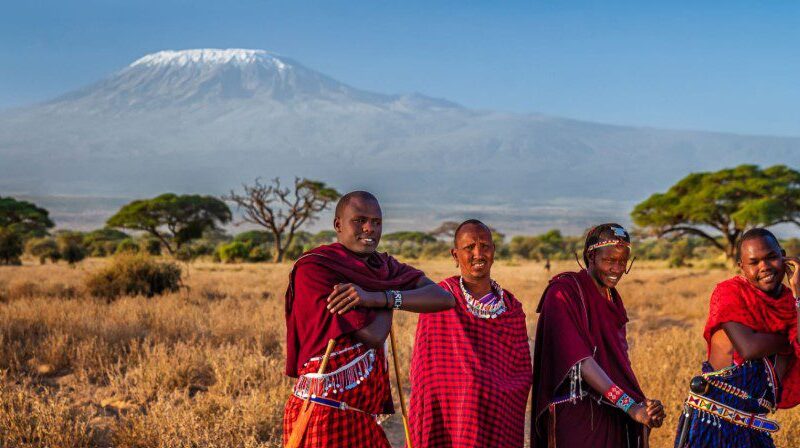 Traditional Maasai dancer performing in vibrant attire, showcasing the rich cultural heritage of the Maasai peopl
