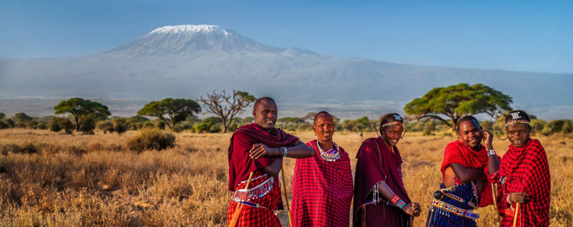 Traditional Maasai dancer performing in vibrant attire, showcasing the rich cultural heritage of the Maasai peopl