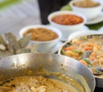 Traditional Swahili cooking dishes, including pilau, sambusa, mandazi, and chapati, showcasing vibrant, flavorful East African cuisine