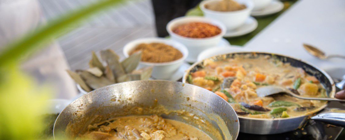 Traditional Swahili cooking dishes, including pilau, sambusa, mandazi, and chapati, showcasing vibrant, flavorful East African cuisine