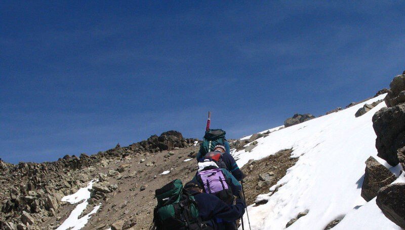 Majestic view of Mount Kenya with snow-capped peaks and lush greenery at lower altitudes