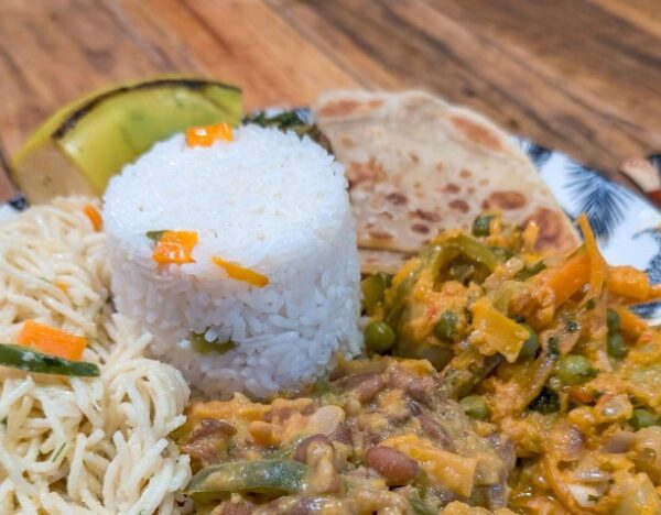 A variety of colorful vegetarian dishes made with fresh vegetables and legumes in Tanzania.