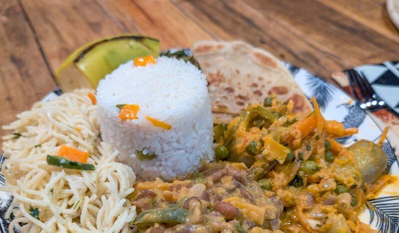 A variety of colorful vegetarian dishes made with fresh vegetables and legumes in Tanzania.