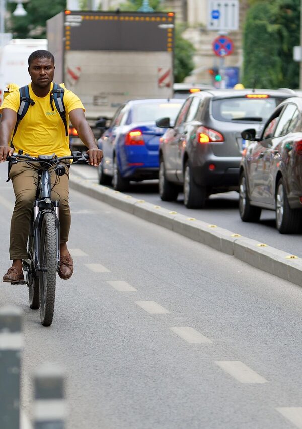 "Tourists enjoying a scenic bike ride through a vibrant city, exploring local landmarks and experiencing the culture on two wheels