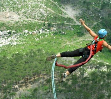 Bungee jumper leaping off a bridge with breathtaking views in Africa 