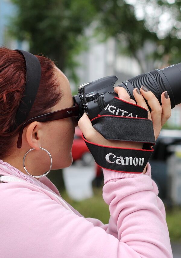 Photographer capturing a moment during a gorilla trekking adventure in the wild