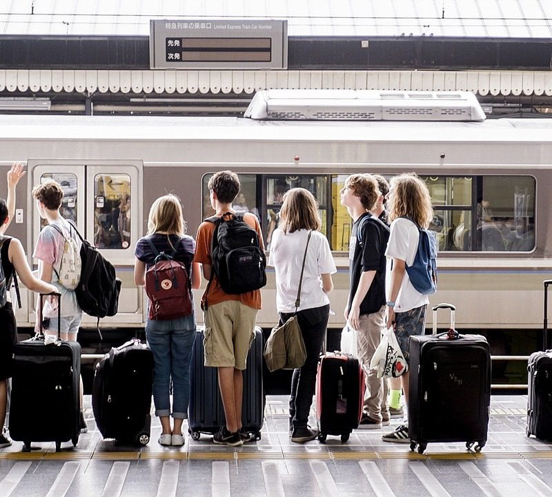 Travelers packing luggage for a safari flight, preparing for an adventurous journey through the wilderness.