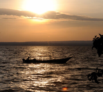 Fisherman on an African lake, fishing in Rwanda lakes