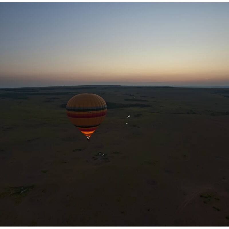 Hot air balloon over Masai Mara at sunrise, Kenya Hot air balloon over Masai Mara at sunrise, Kenya