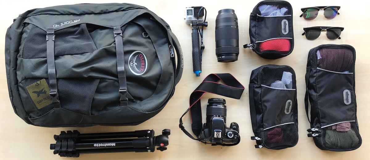 Birding gear, binoculars, boots, field guide, and daypack prepared for Uganda Rwanda safari adventures