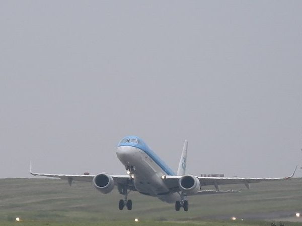 Aircraft landing, representing a flight into Entebbe International Airport