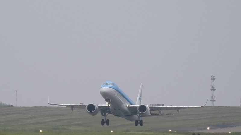Aircraft landing, representing a flight into Entebbe International Airport
