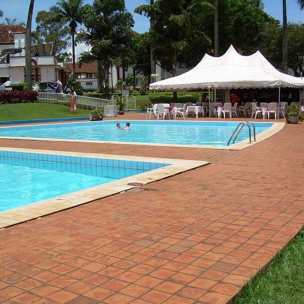 Poolside area at an Entebbe hotel suited to group safari travelers