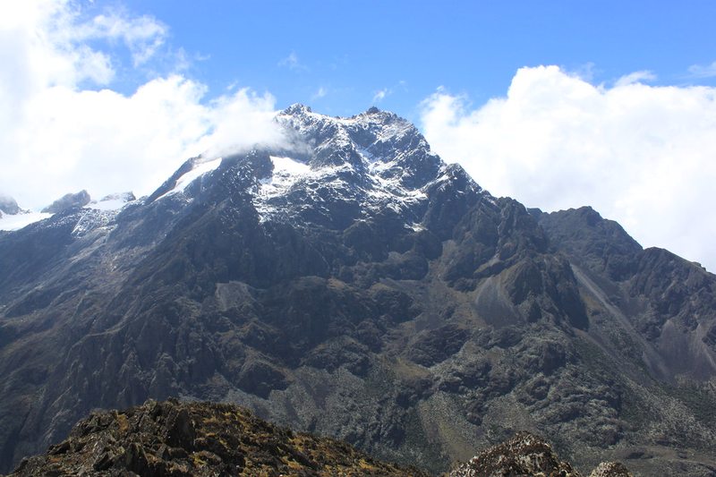 Snow capped glacial peak of the Rwenzori Mountains against a blue sky