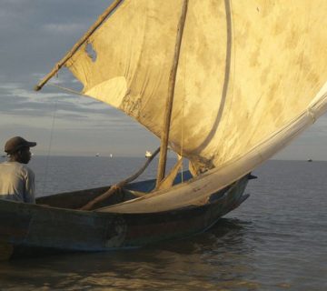 Traditional sailboat at sunset on Lake Victoria