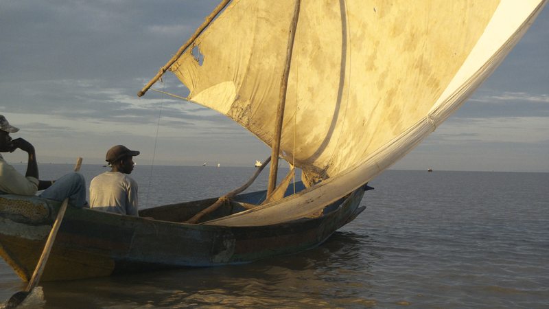 Traditional sailboat at sunset on Lake Victoria