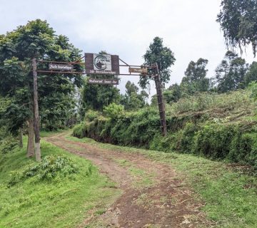 Trailhead sign at the start of the Nyiragongo volcano trek in eastern DRC