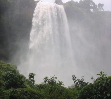 Sipi Falls cascading down a cliff face in eastern Uganda