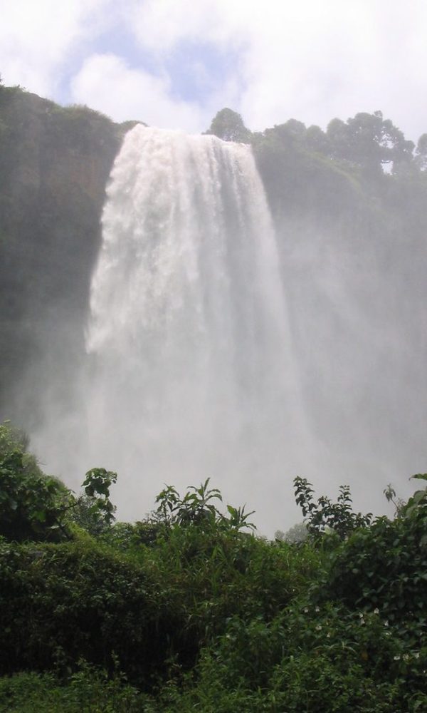 Sipi Falls cascading down a cliff face in eastern Uganda