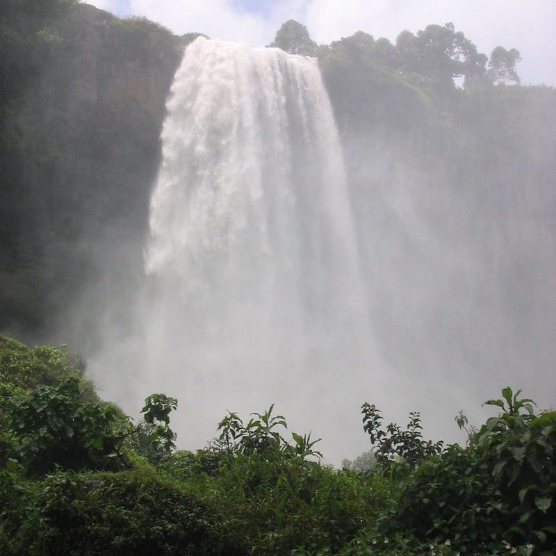 Sipi Falls Waterfall, Uganda Sipi Falls cascading down a cliff face in eastern Uganda