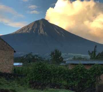 A volcanic peak rising above the landscape at Volcanoes National Park, Rwanda