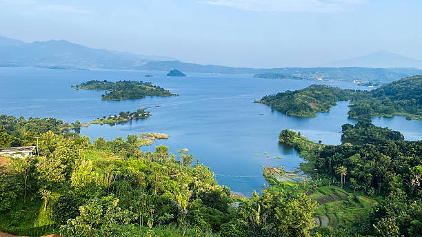 View of Lakes Burera and Ruhondo surrounded by terraced hills with the Virunga Volcanoes in northern Rwanda